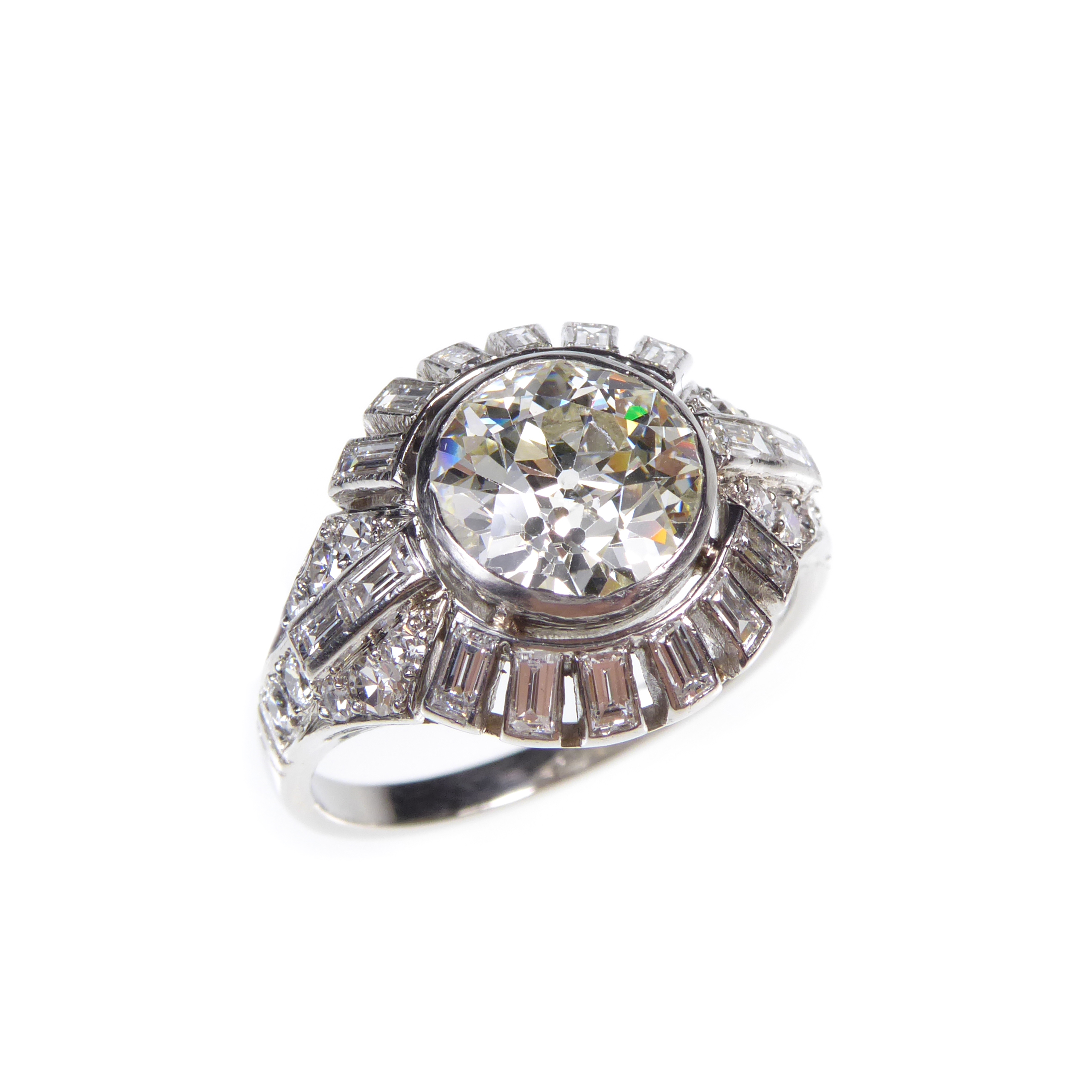 Art Deco diamond sunray cluster ring, c.1935, the old round brilliant cut diamond, approximately 2.30ct, approximately K VS2,